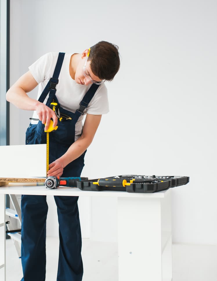 Handyman measuring wood – HandyHawk